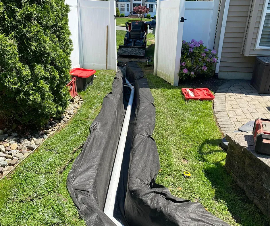 French Drain Installation Project Near Wooden Fence – Columbus, OH